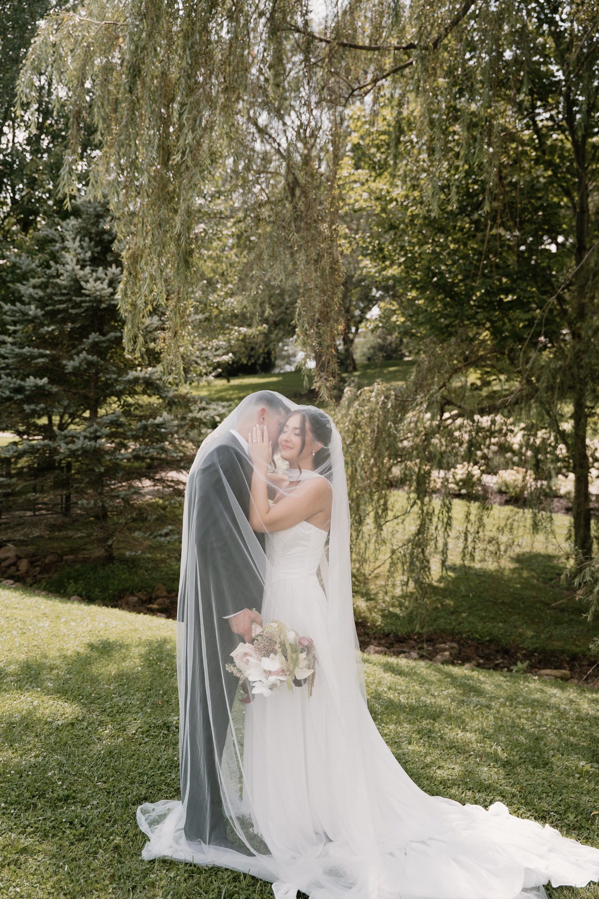 Bride with veil in a garden — soft glam bridal makeup, Pittsburgh PA